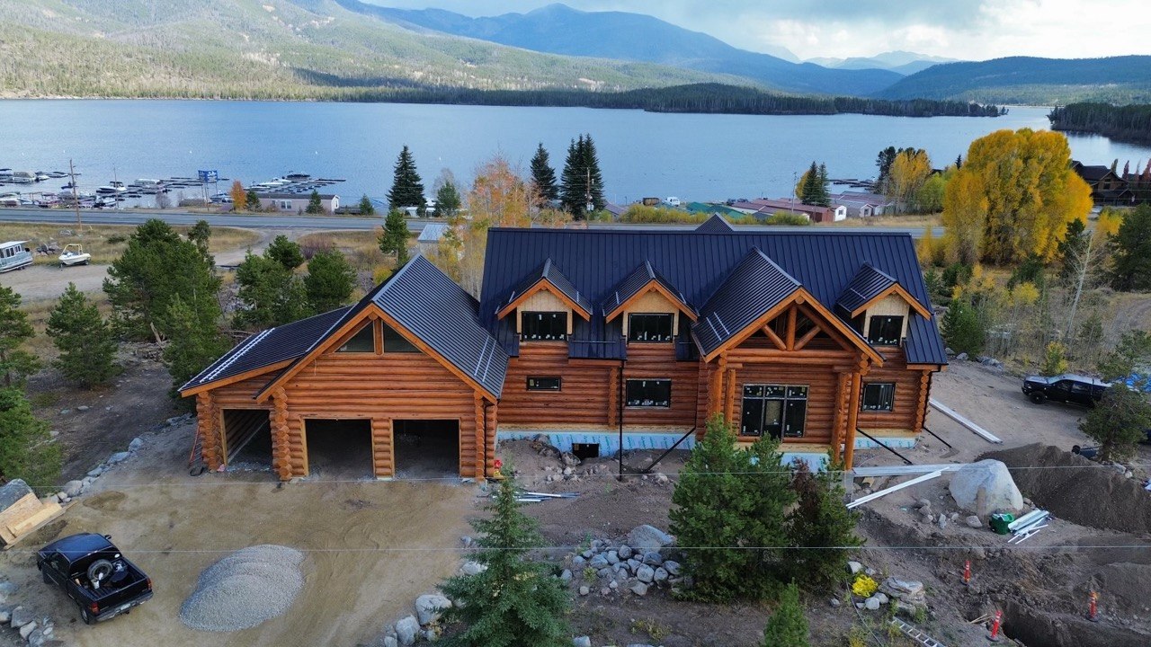 Grand Lake log home from the air, lake and mountain